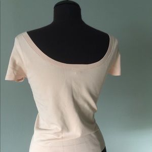 Light pink silk/nylon scoop neck top.